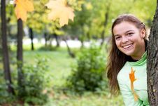 Smiling Girl And Falling Maple Leaves Royalty Free Stock Photography Smiling Girl And Falling Maple Leaves Royalty Free Stock Photography