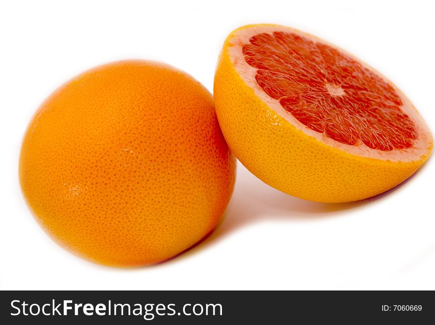 Citrus Fruits - pink half sliced grapefruit. Citrus Fruits - pink half sliced grapefruit