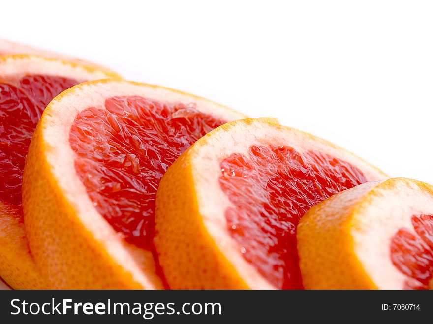 Citrus Fruits - pink sliced grapefruit also for background. Citrus Fruits - pink sliced grapefruit also for background