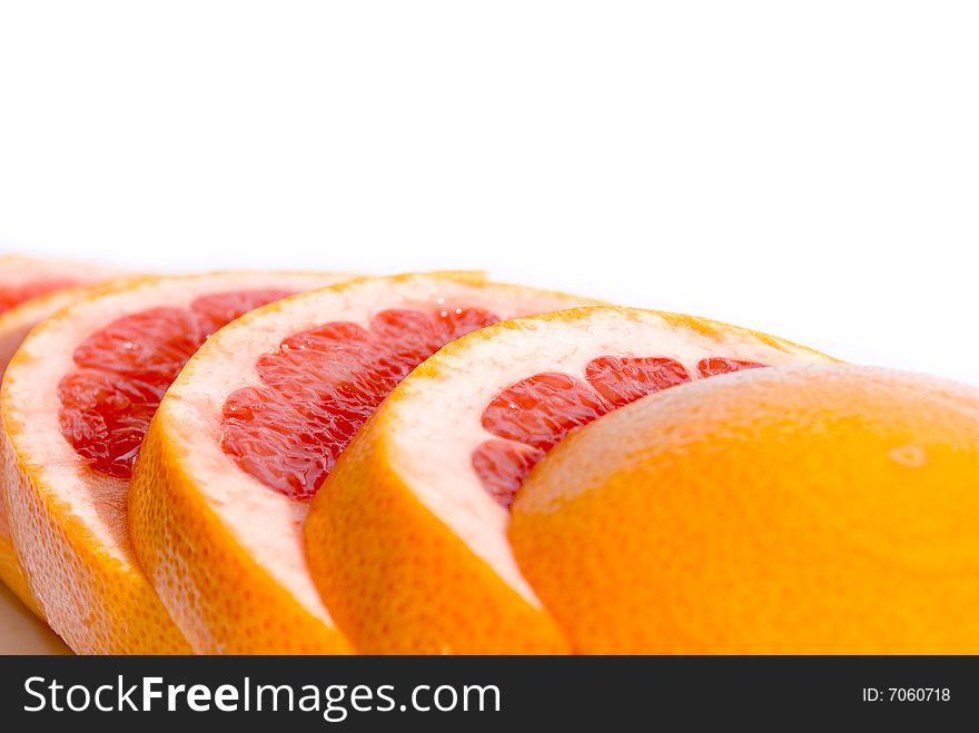 Citrus Fruits - pink sliced grapefruit also for background. Citrus Fruits - pink sliced grapefruit also for background