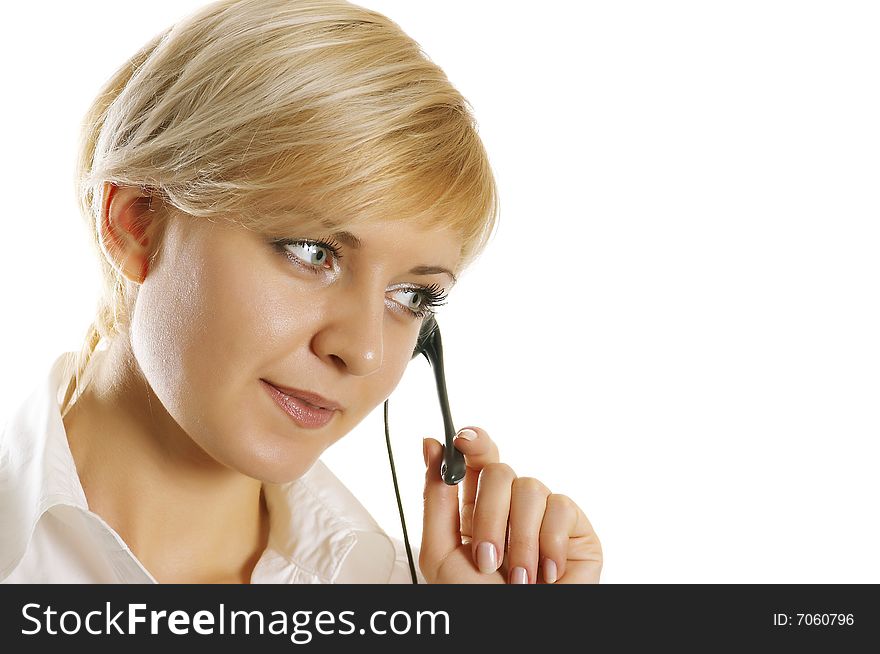 Woman wearing headset in office; could be receptionist. Woman wearing headset in office; could be receptionist