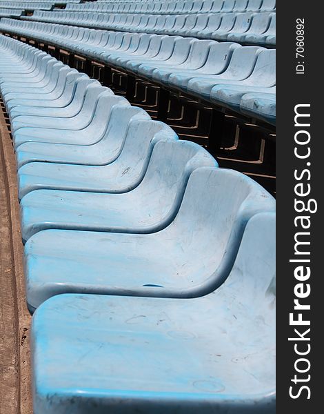 Blue stadium seats in a row