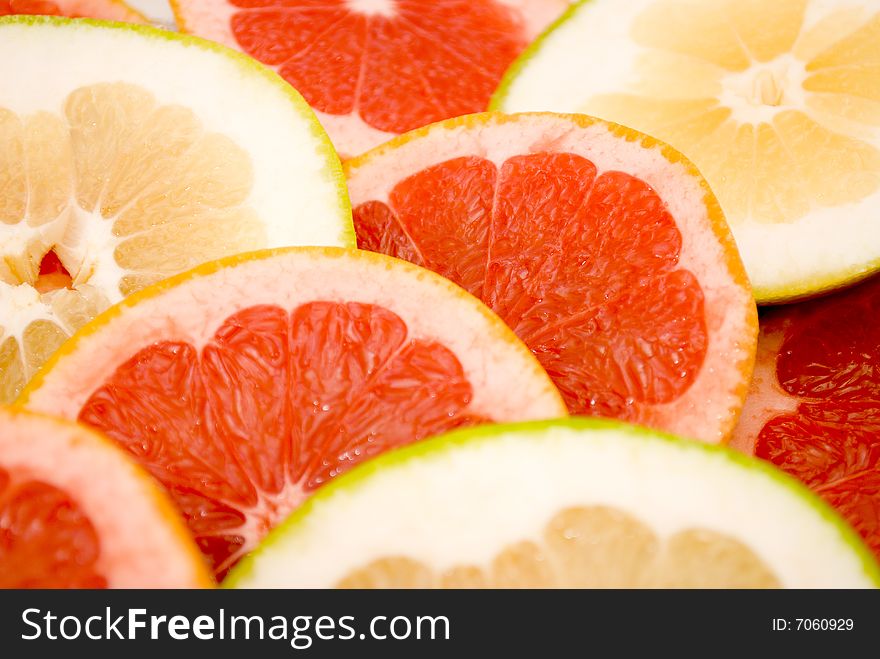 Citrus Fruits - pink and green sliced grapefruits