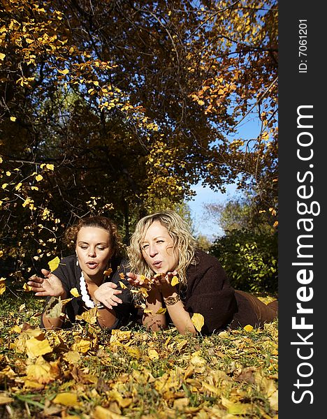 Two beautiful girl in park in the autumn. Two beautiful girl in park in the autumn