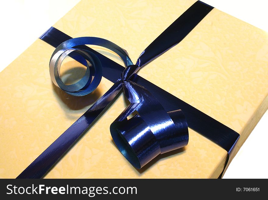 Colored gift box with blue ribbon