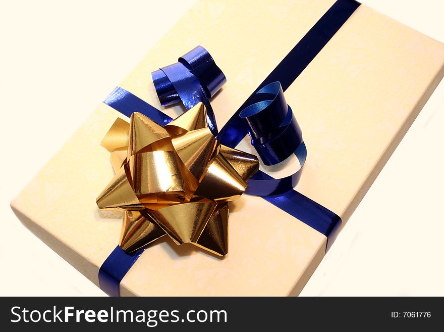 Colored gift box with blue and gold ribbon