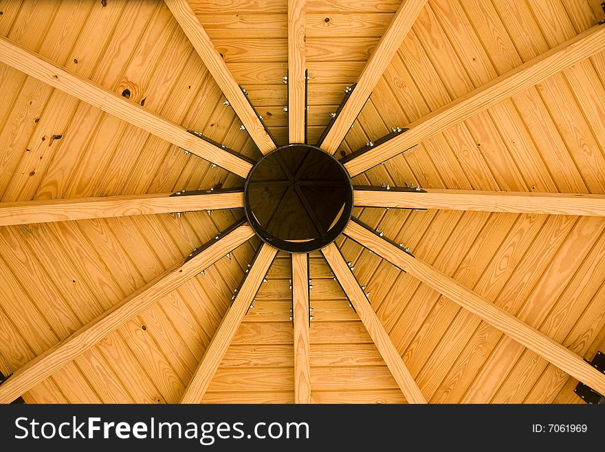 A circular roof made of wood and iron. A circular roof made of wood and iron