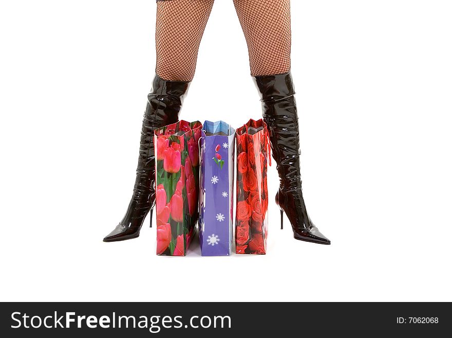 Pretty woman with shopping bags isolated on the white background