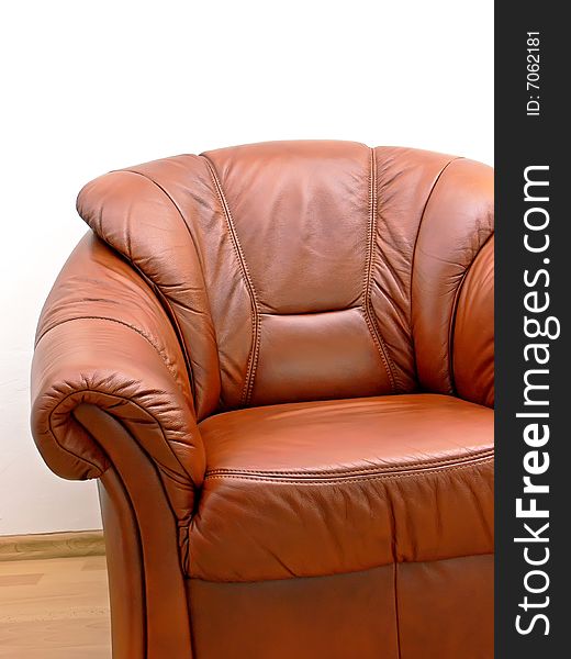 Fragment of comfortable brown leather armchair. Fragment of comfortable brown leather armchair.