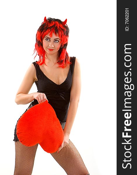 Sexy devil woman and red heart isolated on the white background