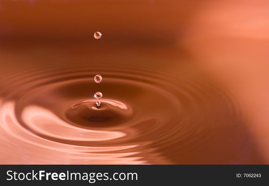 Water droplets close up in orange. Water droplets close up in orange