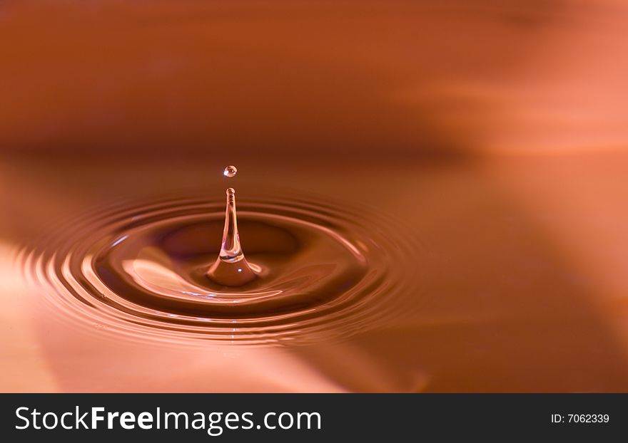 Water droplets close up in orange. Water droplets close up in orange