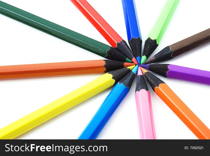Several multicolored crayons on white background