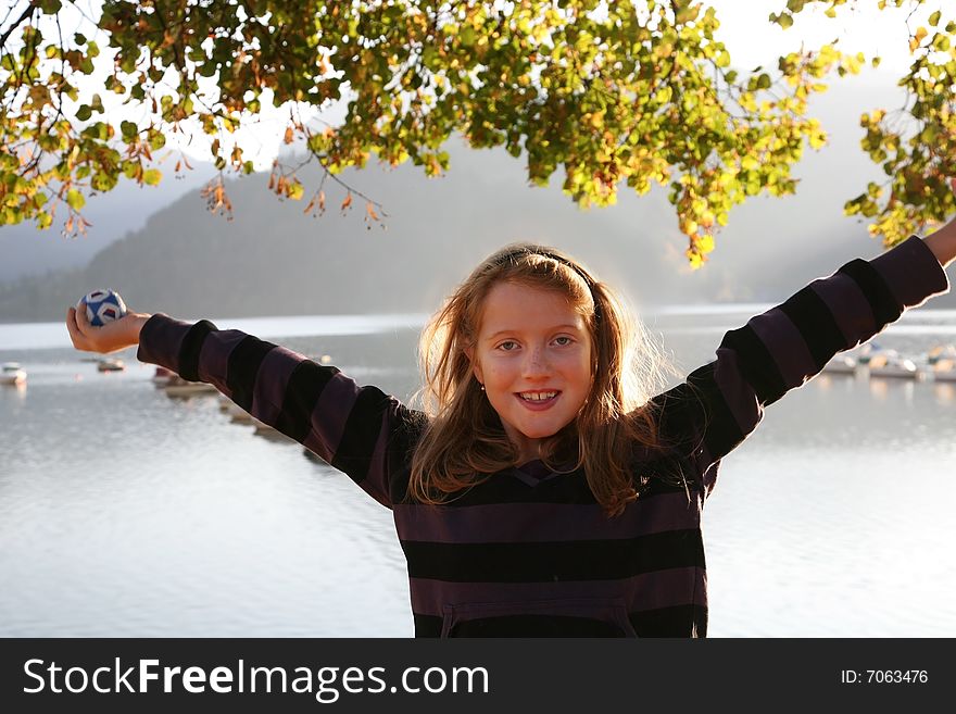 Happy Girl At The Autumn Lake