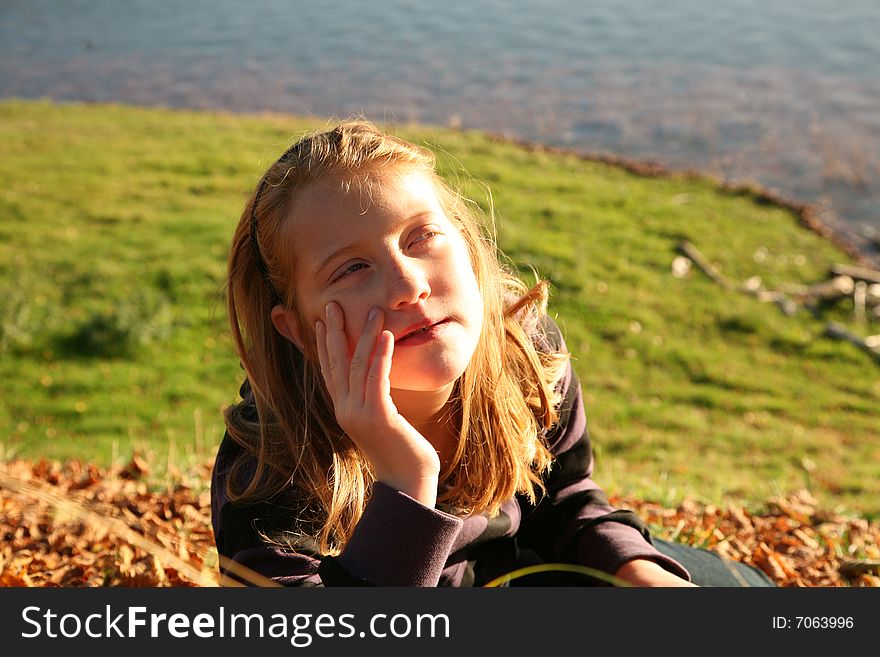 Portrait with a girl in the evenings sunbeams. Portrait with a girl in the evenings sunbeams