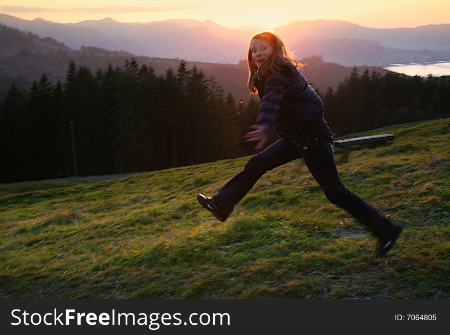 Jumping girl in the sunset