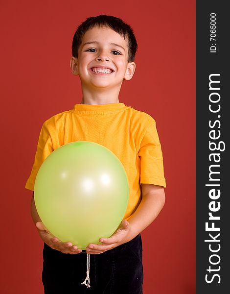 Smiling boy with green ballon. Smiling boy with green ballon