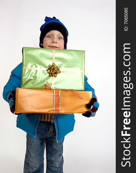 Little smiling boy with christmas gifts. Little smiling boy with christmas gifts