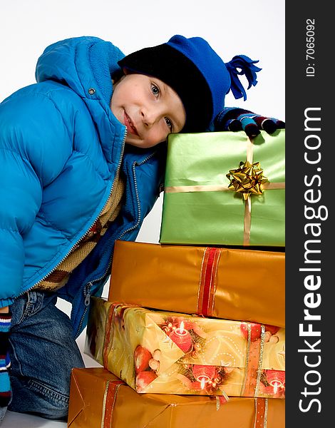 Little smiling boy with christmas gifts. Little smiling boy with christmas gifts