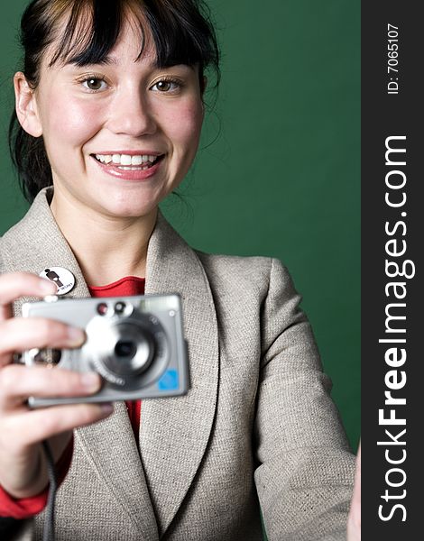 Young woman closeup portrait taking picture with digital camera. Young woman closeup portrait taking picture with digital camera