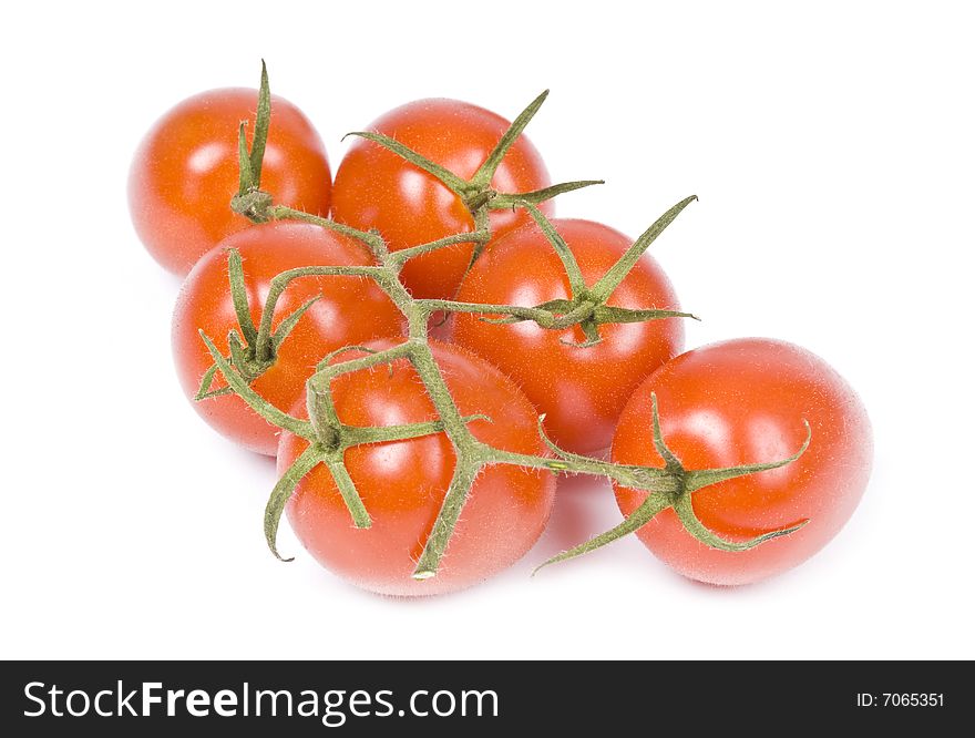 Bunch of baby roma tomatoes isolated on white.