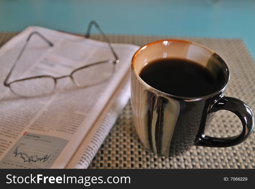 Morning coffee and magazine at the table