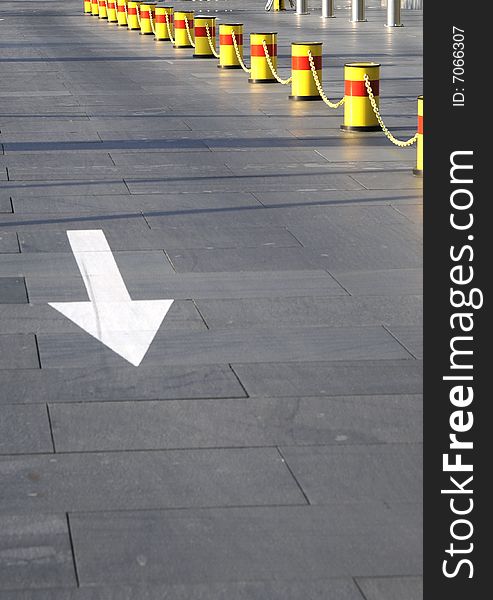 Sign of direction on the road, warning chain and arrow sign