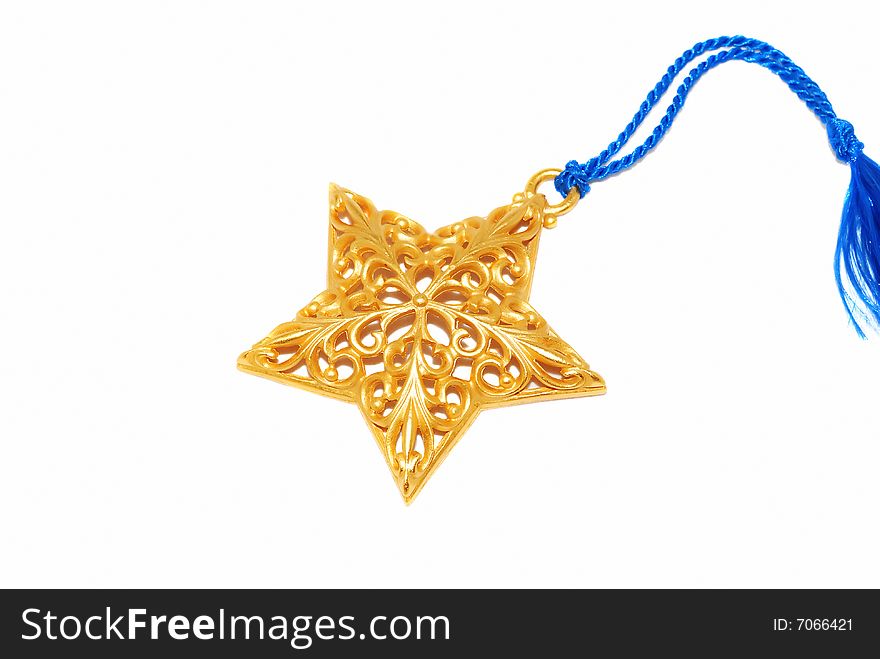 Gold Christmas star ornament with silk ribbon isolated on the white.