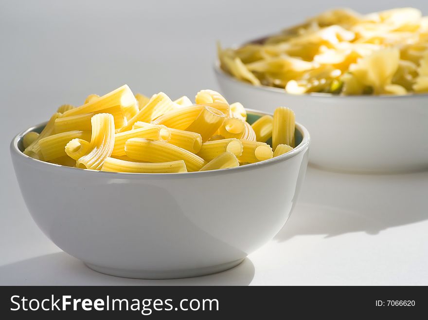 Fresh uncooked raw italian pasta isolated over white