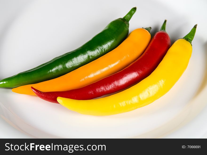 Red hot chili pepper on white plate. Red hot chili pepper on white plate