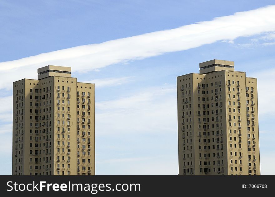 Residential building with cloudy sky, twins tower of residential building