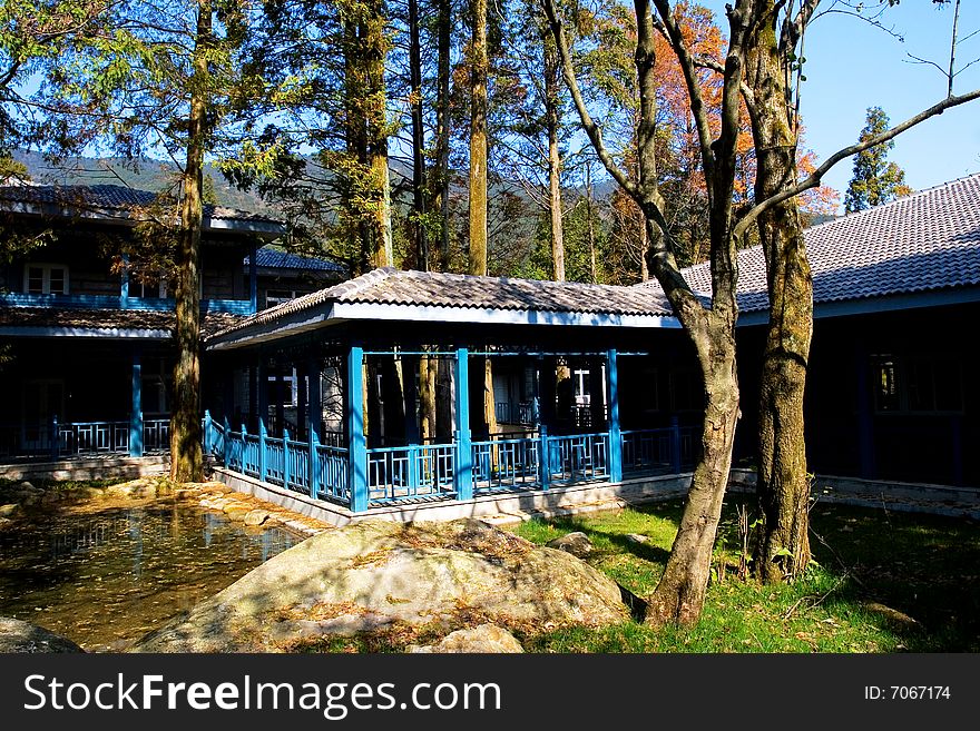 The chinese courtyard in the autumn trees.