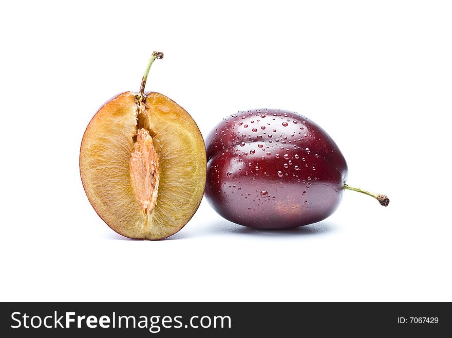 Plum And A Half On  White Background, Isolation