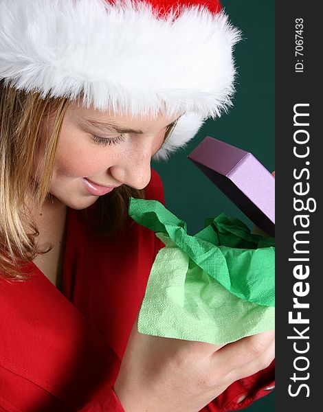 Beautiful teenager wearing a red shirt and christmas hat. Beautiful teenager wearing a red shirt and christmas hat