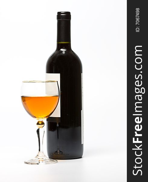 Glass and bottle of wine over white background.
