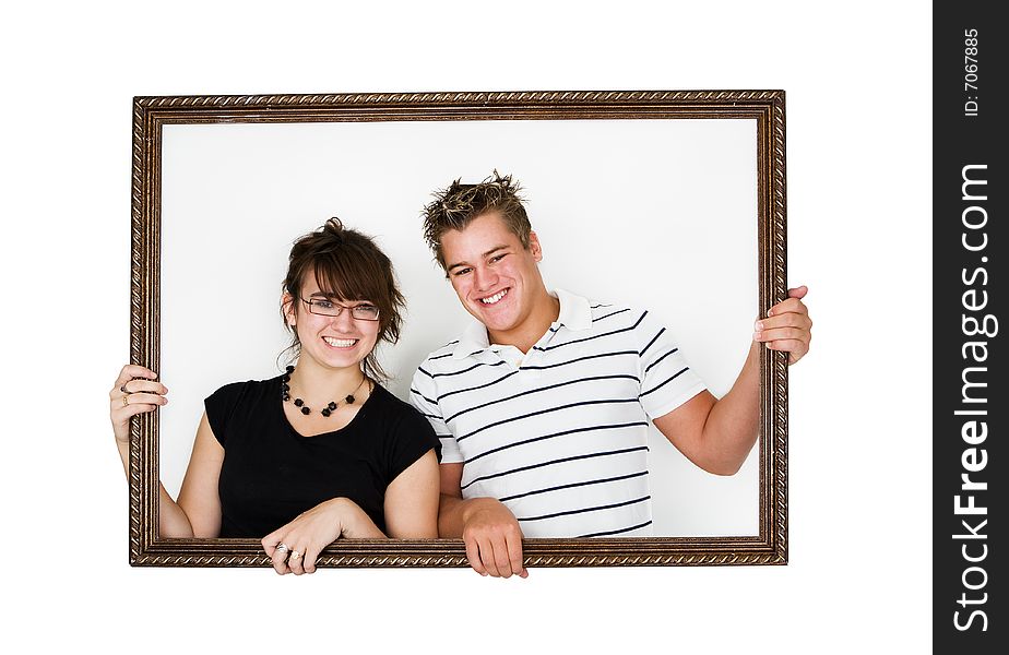 Young smiling couple in a picture frame. Young smiling couple in a picture frame