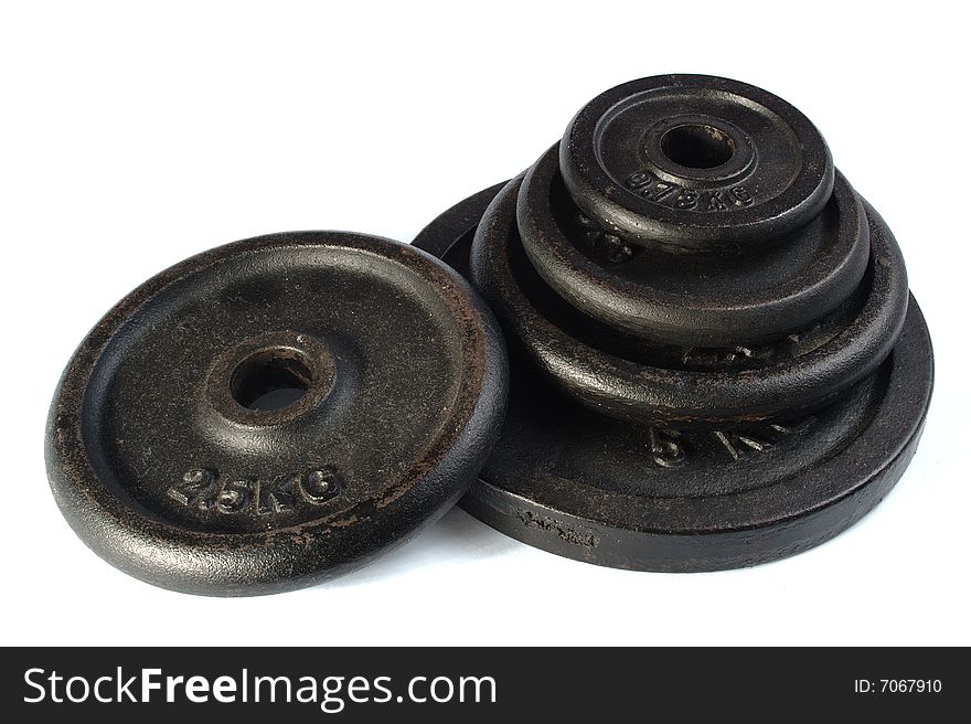 Old dirty dumbbell plates isolated on white background. Old dirty dumbbell plates isolated on white background.