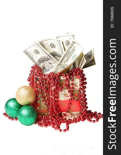 Money in a red gift box on a white background