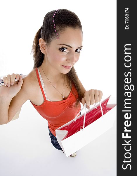 Beautiful female with shopping bags on an isolated background