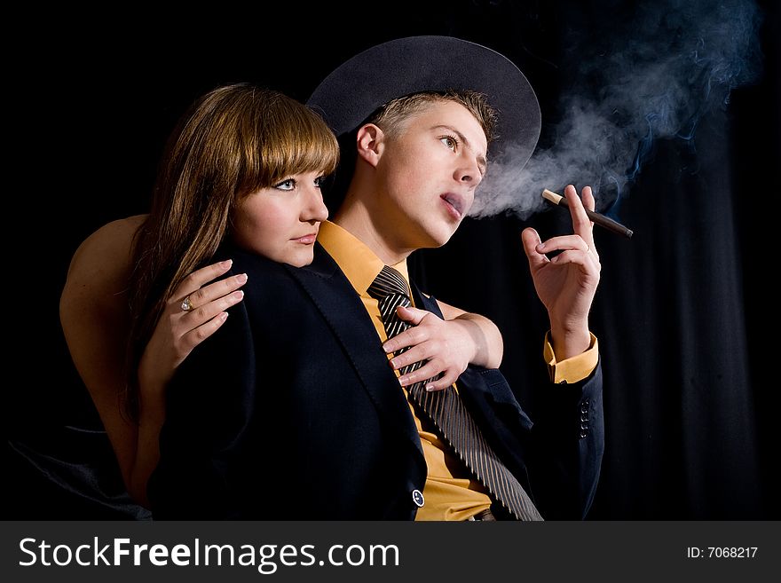 An image of woman and man with cigar. An image of woman and man with cigar