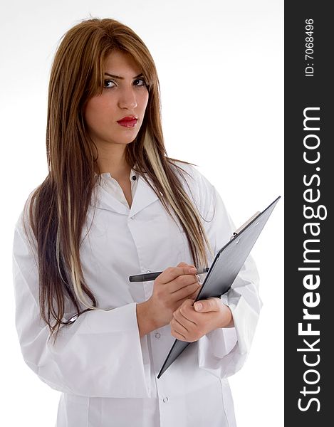 Pretty doctor posing with writing board on an isolated background