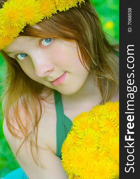 Fine girl with big bouquet dandelion