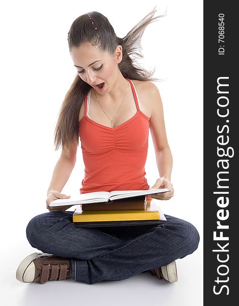 Surprised student looking into book