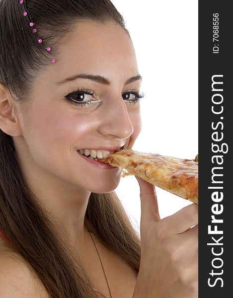 Young girl eating pizza on an isolated white background