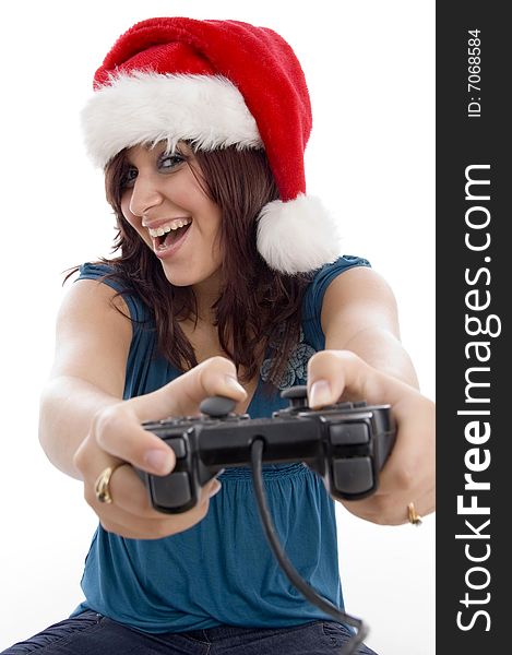 Brunette female with christmas hat and remote against white background