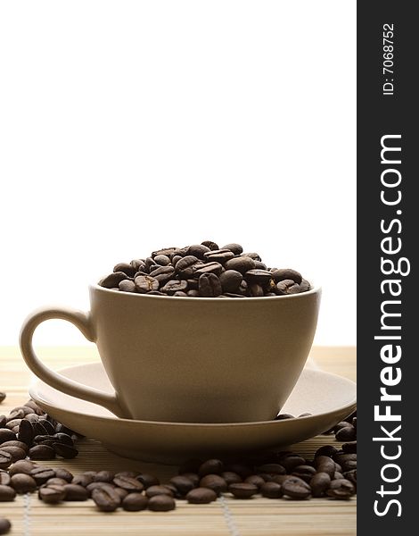 Cup of coffee and coffee beans isolated