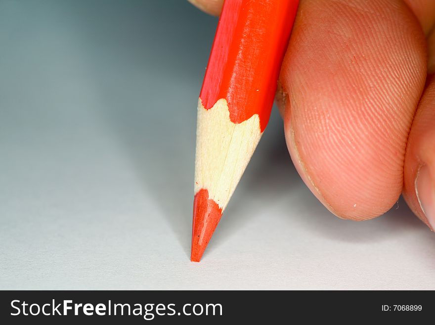 Closeup image of red pencil on notepad. Closeup image of red pencil on notepad
