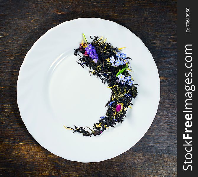 Dried tea in white plate