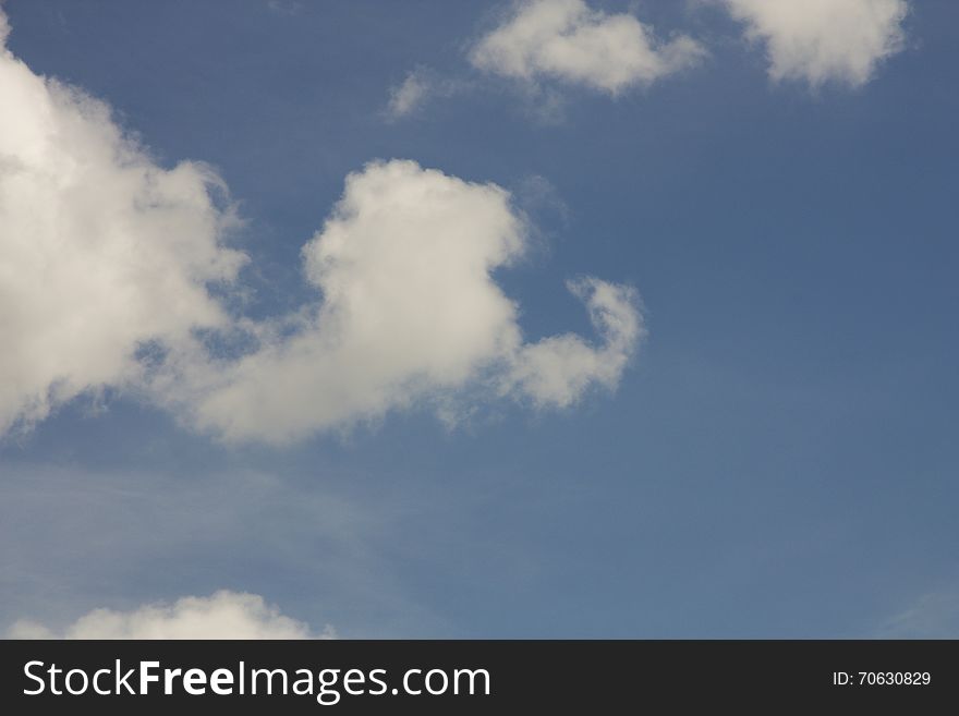 Fluffy white clouds in the blue sky. Fluffy white clouds in the blue sky