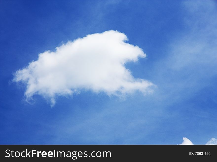 Fluffy white clouds in the blue sky. Fluffy white clouds in the blue sky